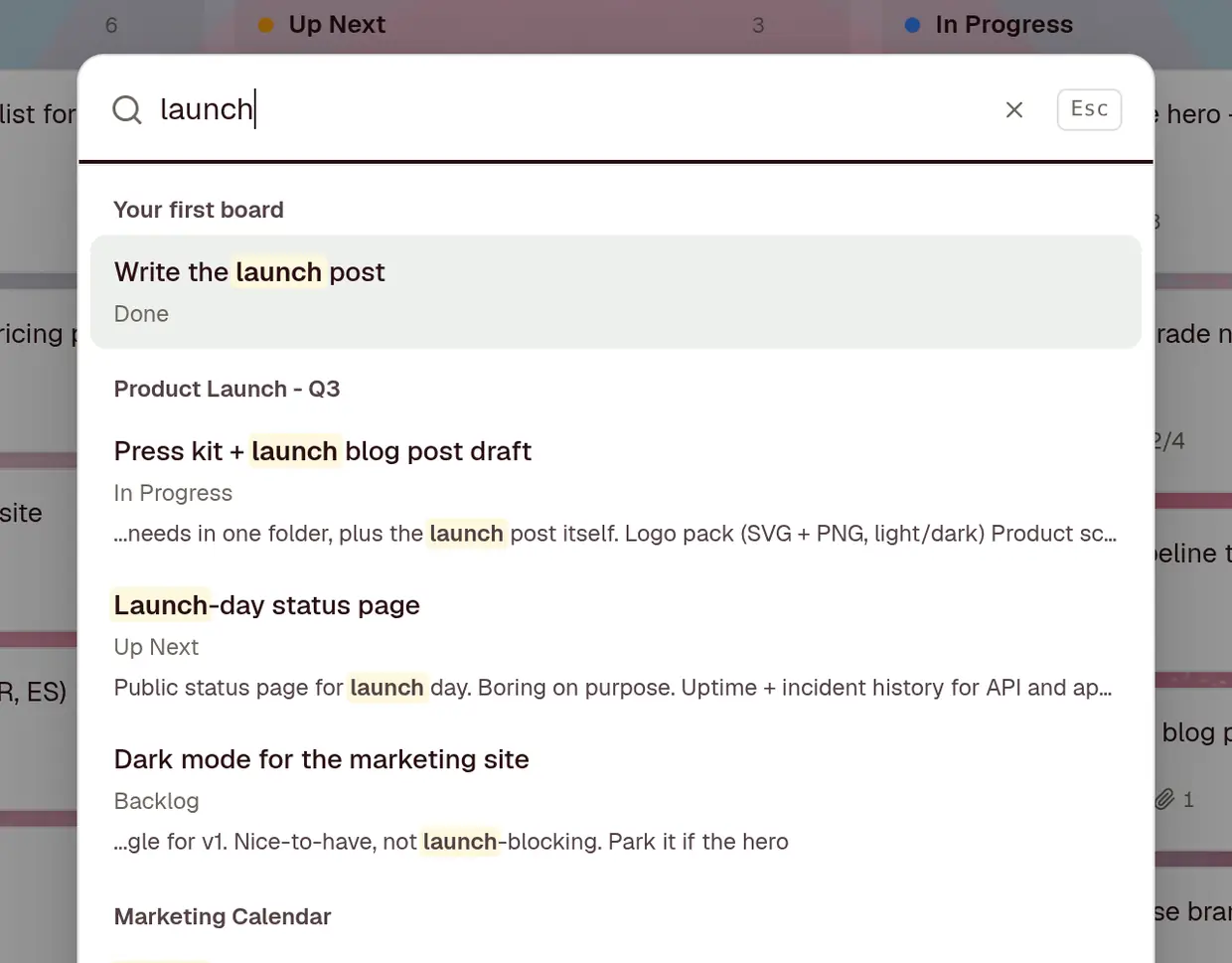 A search for launch across boards, with matches grouped by board and highlighted in titles and descriptions.
